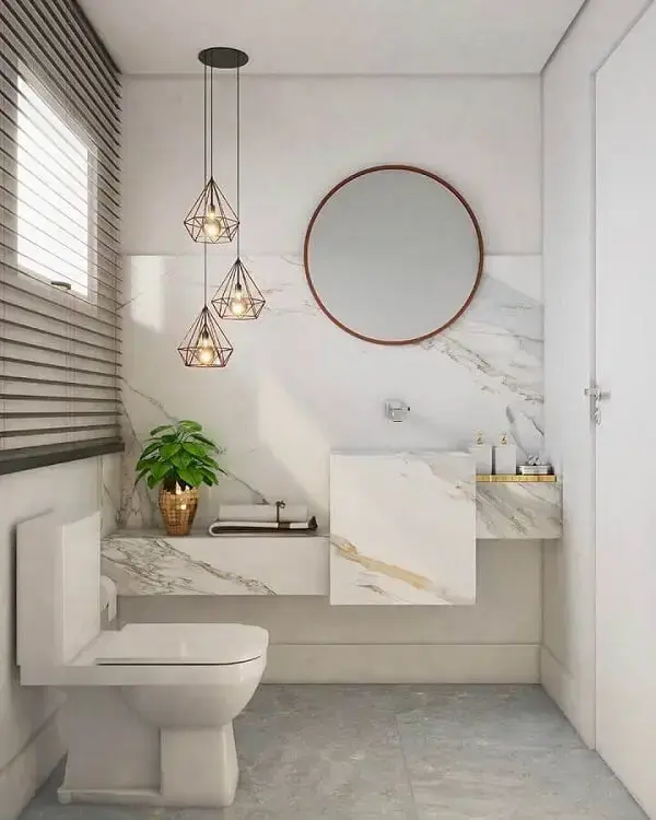 Decoração sofisticada com bancada de mármore planejada e Luminária de banheiro pendente