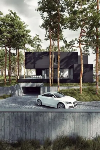 Garagem subterrânea em casa moderna com fachada preta (foto: Futurist Architecture)