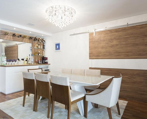 Projeto residencial de sala de jantar com bar e mesa de jantar retangular projeto C+H Arquitetura